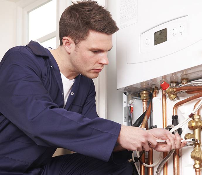 Gas boiler service engineer while working