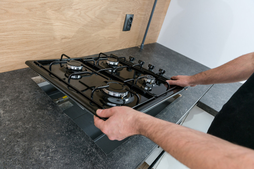 Entrust your gas hob installation in London to us Expert installing a gas hob in a London home