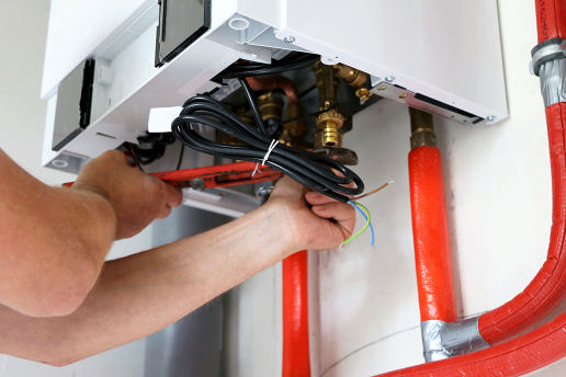 Get expert central heating installation in London plumber installing central heating system in a London property